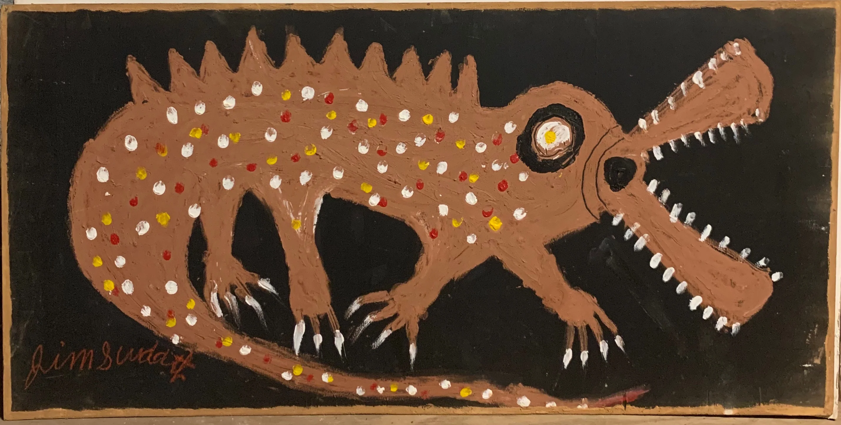 A painting of an alligator, its brown coat dressed up with polka dots of red, yellow, and white.